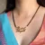 Lyba Crown and Heart Couple Name Necklace